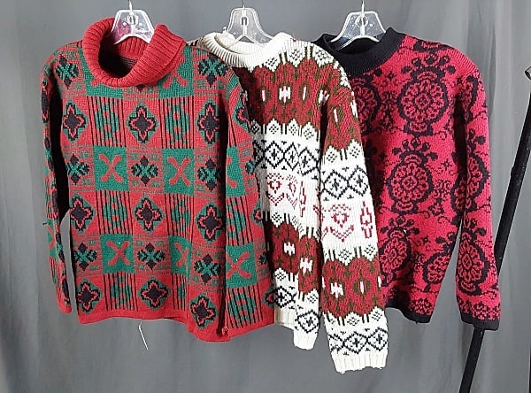3 Vintage 1960s Knitted Sweaters: Three Vintage 1960s Knitted Sweaters. The lot consists of three vintage 1960s knitted sweaters. Featured are three vintage 1960s knitted sweaters with red being a prominent accent in the lot. There is
