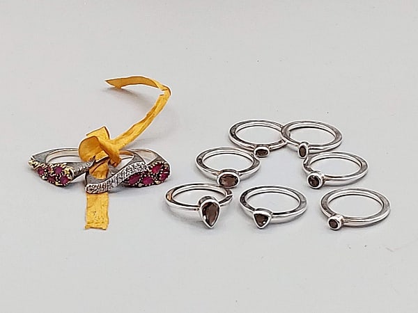 2 Sets of Sterling and Gemstone Stackable Rings: 2 Sets of Sterling and Gemstone Stackable Rings. The lot includes two sets of stackable sterling and gemstone rings. Featuring a set of seven sz 8 sterling stackable rings by Janice Girardi all set wi
