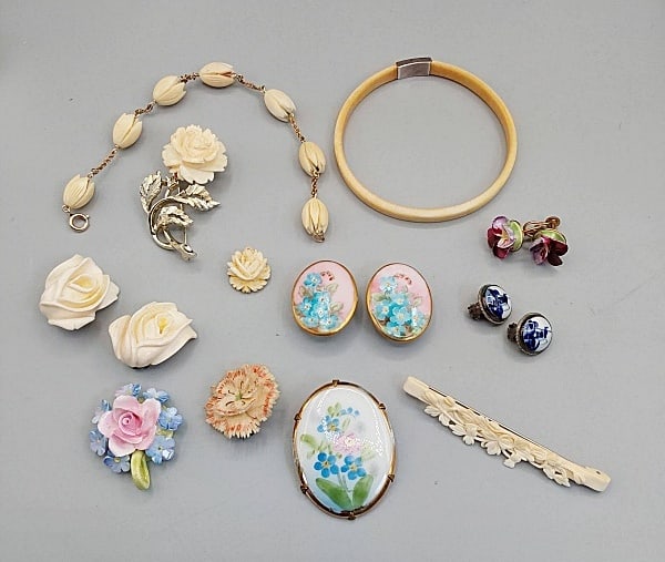 Group of Vintage Carved Bone and Painted Porcelain Jewelry: Group of Vintage Carved Bone and Painted Porcelain Jewelry. The lot includes a mic of various vintage carved bone and painted porcelain jewelry. Featuring a vintage 12K gold filled 8'' long chain brac