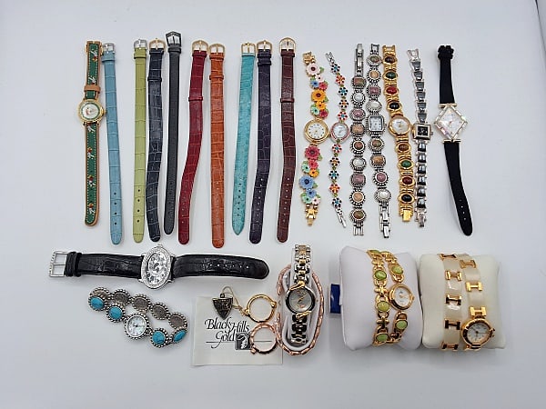 Beverly Hills Gold Watch and More: Lot to include a Beverly Hills Gold watch with an interchangeable band - The leaves on the inside of the watch are 12K gold, a black leather watch band by Victoria Wieck with a oval clock face, two go