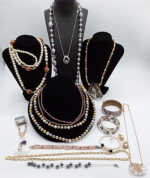 Faux Pearl Jewelry: Lot to include: A 36" long faux pearl and aura beaded necklace; a mother-of-pearl and stone necklace with a plastic 2 14" long horse pendant; a 44" long faux pearl necklace in clear, yellow and silver