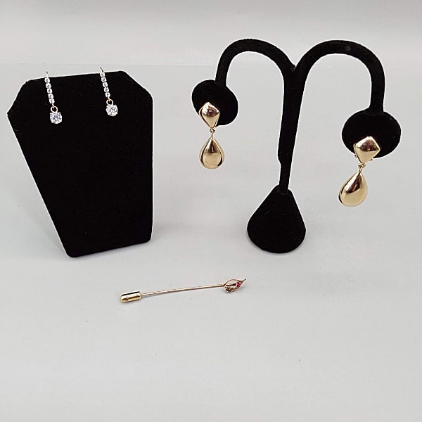 14K Earrings and Stick Pin: Two pairs of marked 14K earrings. The first pair is for pierced ears detailed with 5 cubic zirconia with a large CZ drop. The second pair is clip on earrings with teardrop drops that are 1.5” lo