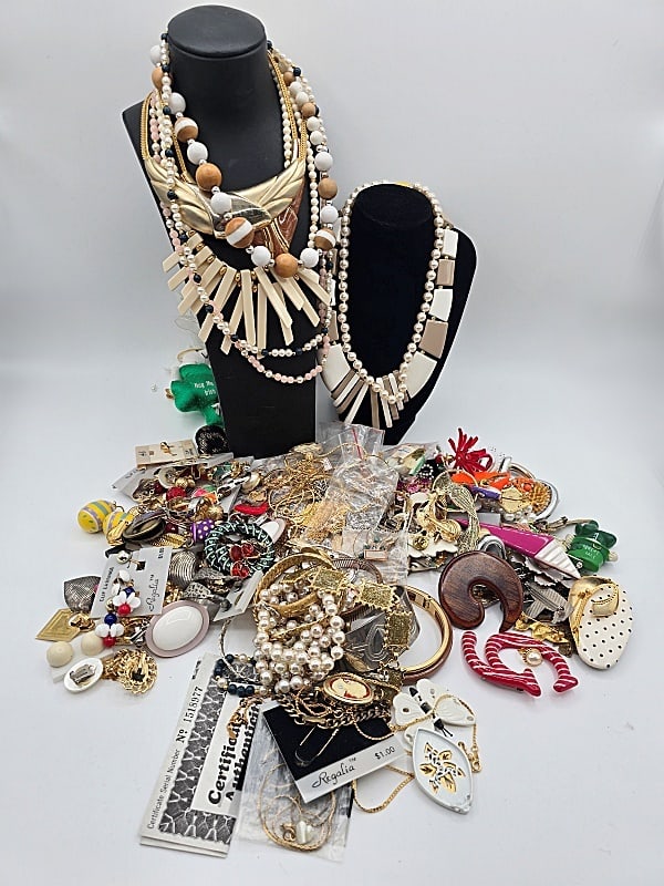Assorted Costume Jewelry: A large grouping of assorted costume jewelry to include earrings, necklaces, bracelets, brooches and more! Also includes Trifari, Pastelli, Monet, Austria Crystal and more! In overall good condition,