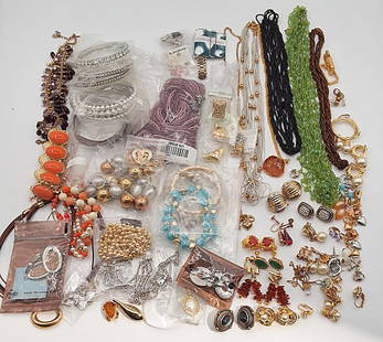 Costume Jewelry Lot: An assorted variety of costume jewelry to include necklaces, bracelets and earrings in an assortment of styles and tones. Some pieces on or in their original packaging. If you have any doubt, please a