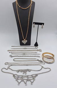 Rhinestone Costume Lot: An assorted grouping of rhinestone decorated jewelry to include bracelets, necklaces and a pair of clip-on earrings. Please pay specific attention to the photo with a rhinestone necklace and hook clas