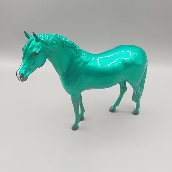 Breyer 2022 Gabriel Green Christmas Morning Surprise #712458: Breyer 2022 Gabriel Green Christmas Morning Surprise #712458. Traditional Breyer horse in original glossy metallic green finish in the German Riding Pony mold, 2022 web special, stamped on belly Gabri