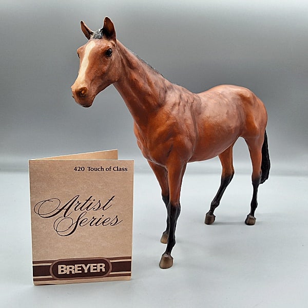 Breyer Touch of Class Artist Series #420: Breyer Touch of Class Artist Series #420. Traditional Breyer horse in original bay finish with white blaze, with Artist Series booklet, in good condition with light overall spotting/discoloration and 