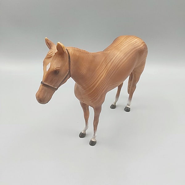 Breyer Woodgrain Racehorse #936: Breyer Woodgrain Racehorse #936. Traditional Breyer horse in original woodgrain finish with four white socks and black halter, c1960s, in very good condition with an abrasion on the right side where a