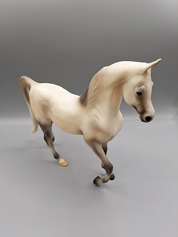 Breyer 2003 Silent Night Holiday Horse #700403: Breyer 2003 Silent Night Holiday Horse #700403. Traditional Breyer horse in original flea bitten grey with chestnut speckles finish in the Khemosabi mold. In good condition with a large rubbed area on