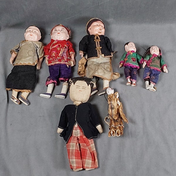 Group of 7 Chinese Dolls: Group of 7 Chinese Dolls. The 7 dolls are from the 1920s and 3 are made from paper mache and are about 11". They are in Chinese costume. Male and female set of two dolls that are 7" paper mache Chines