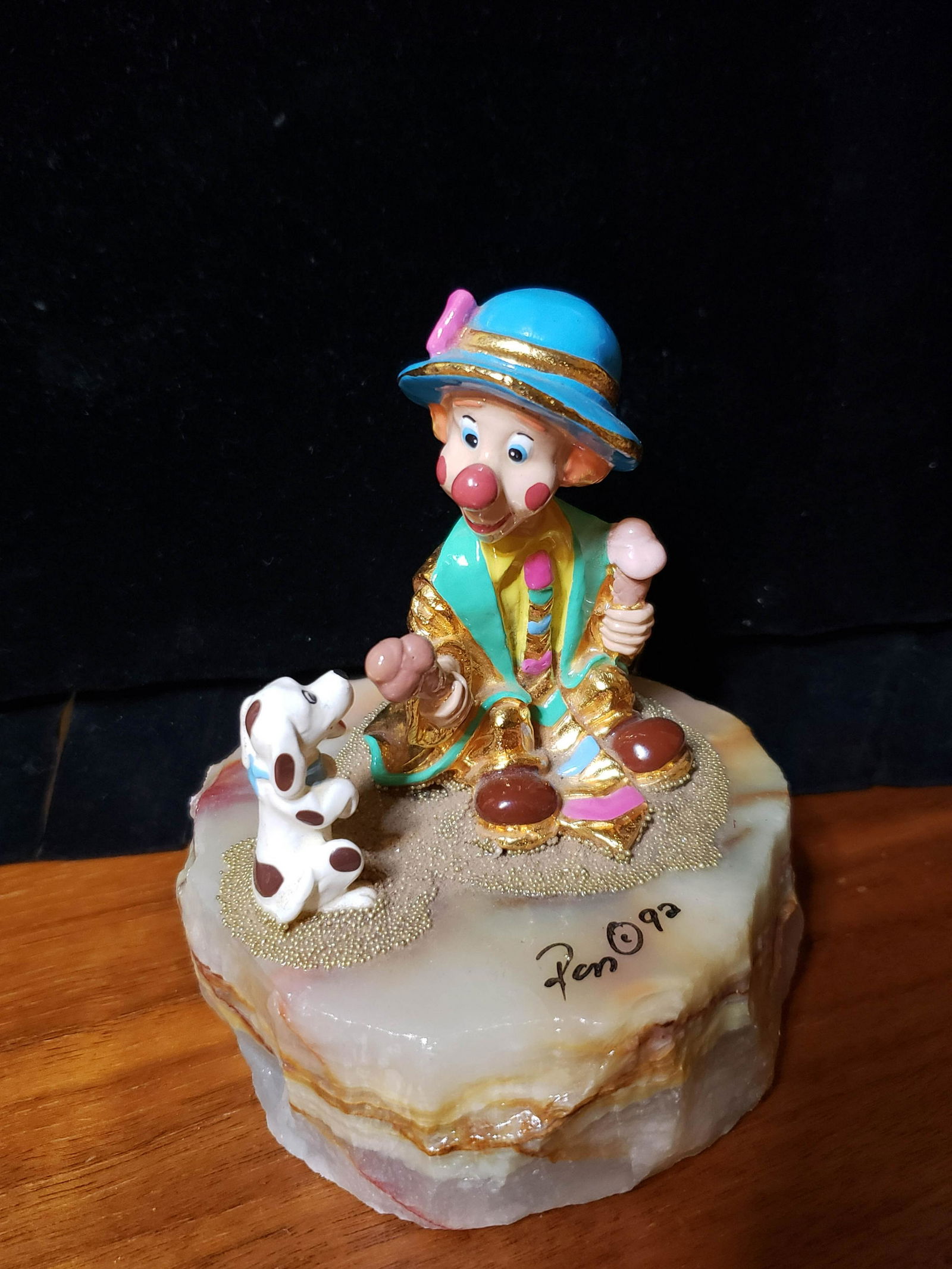 1992 Ron Lee Puppy Loves Treat: Dated, numbered, and signed by the artist Ron Lee. Gilded in 24k gold and sits upon a genuine onyx base. Label on the base shows "L-277 Puppy Loves Treat".4" tall by 3.28" base diameter.