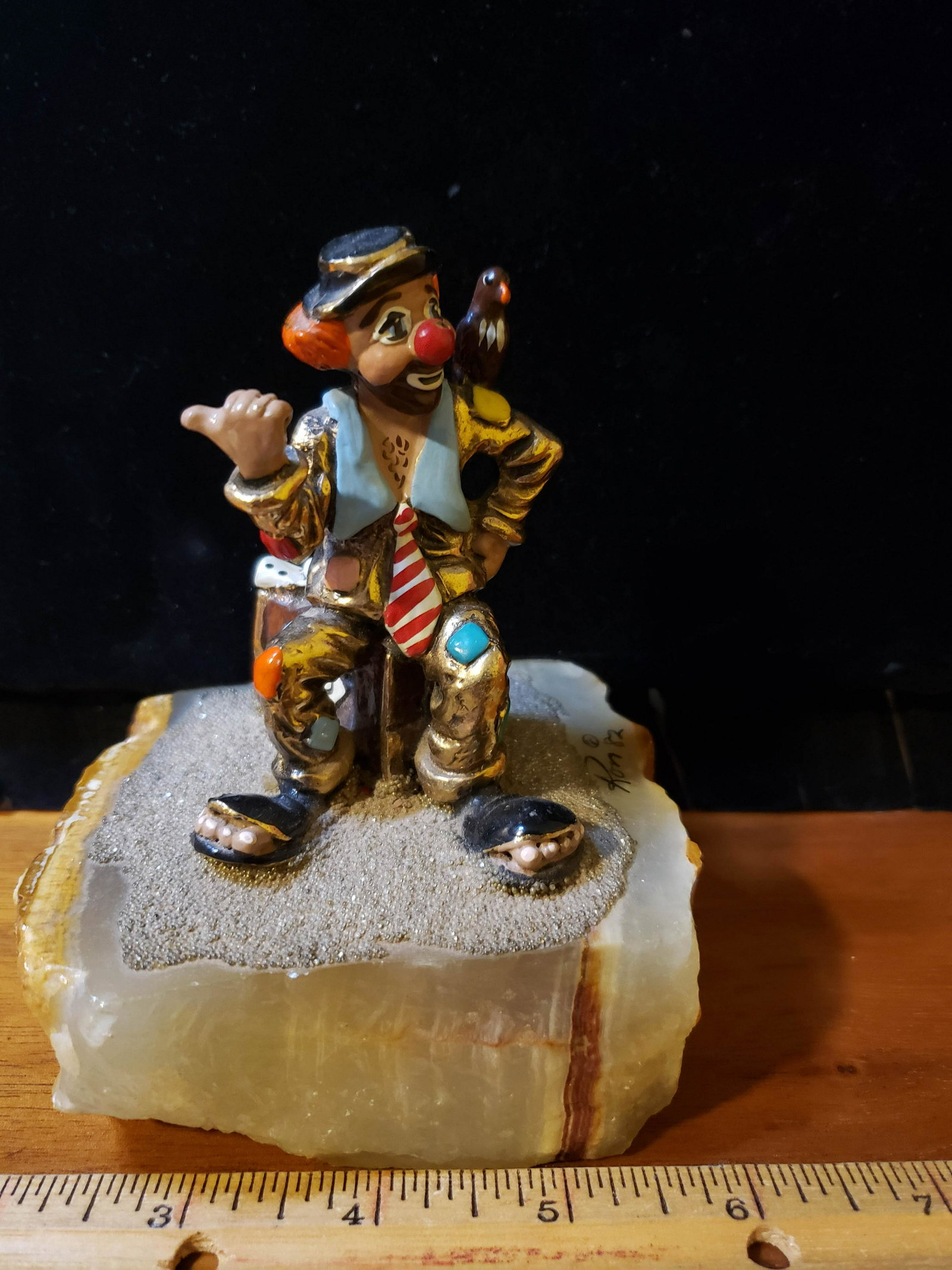 Ron Lee Hobo Sitting on Suitcase: Hobo with crow perched on his shoulder, while trying to hitch a ride...somewhere. Gilded in 24k gold an sitting on Mexican onyx/alabaster. 4.8\" tall with 4\" x3.1\" base.