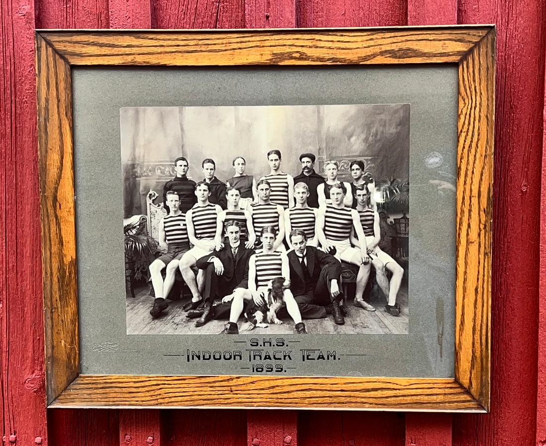 1899 Indoor Track Team Sports Photograph: The uniforms and pose of team is so decorative. Original frame and untouched condition. Measures 21.5 by 25.5 and image 13.25 by 16.25 inches. WHAT'S TO LOVE - The dog mascot.