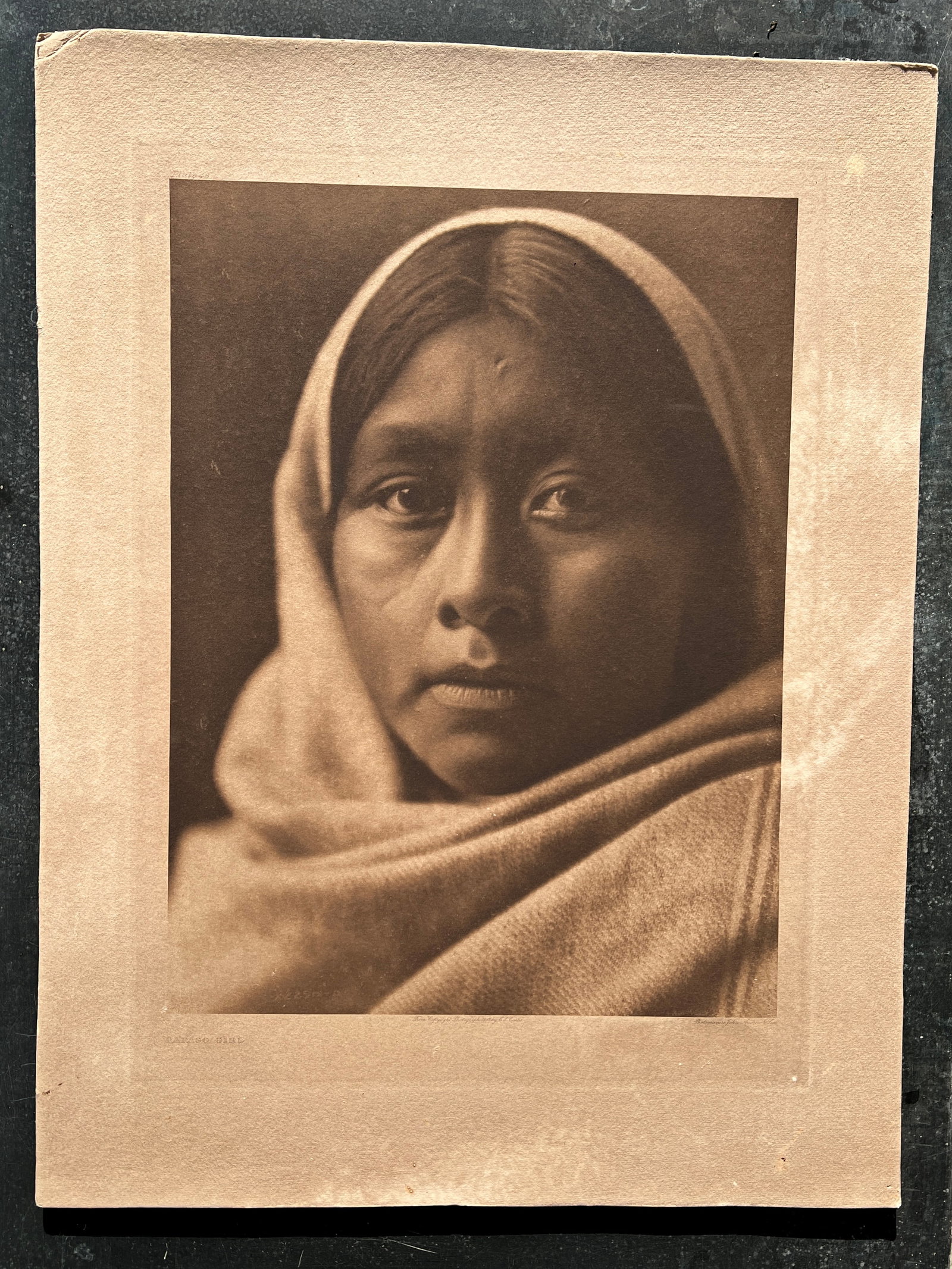 Edward S Curtis American Indian Photogravure Photograph Papago Girl: Original photogravure. Original period image. Written in margins - Plate 48 - Papago Girl - From Copyright Photograph 1907 E S Curtis - Photogravure John Andres & Son. This is on heavy cardboard. Imag