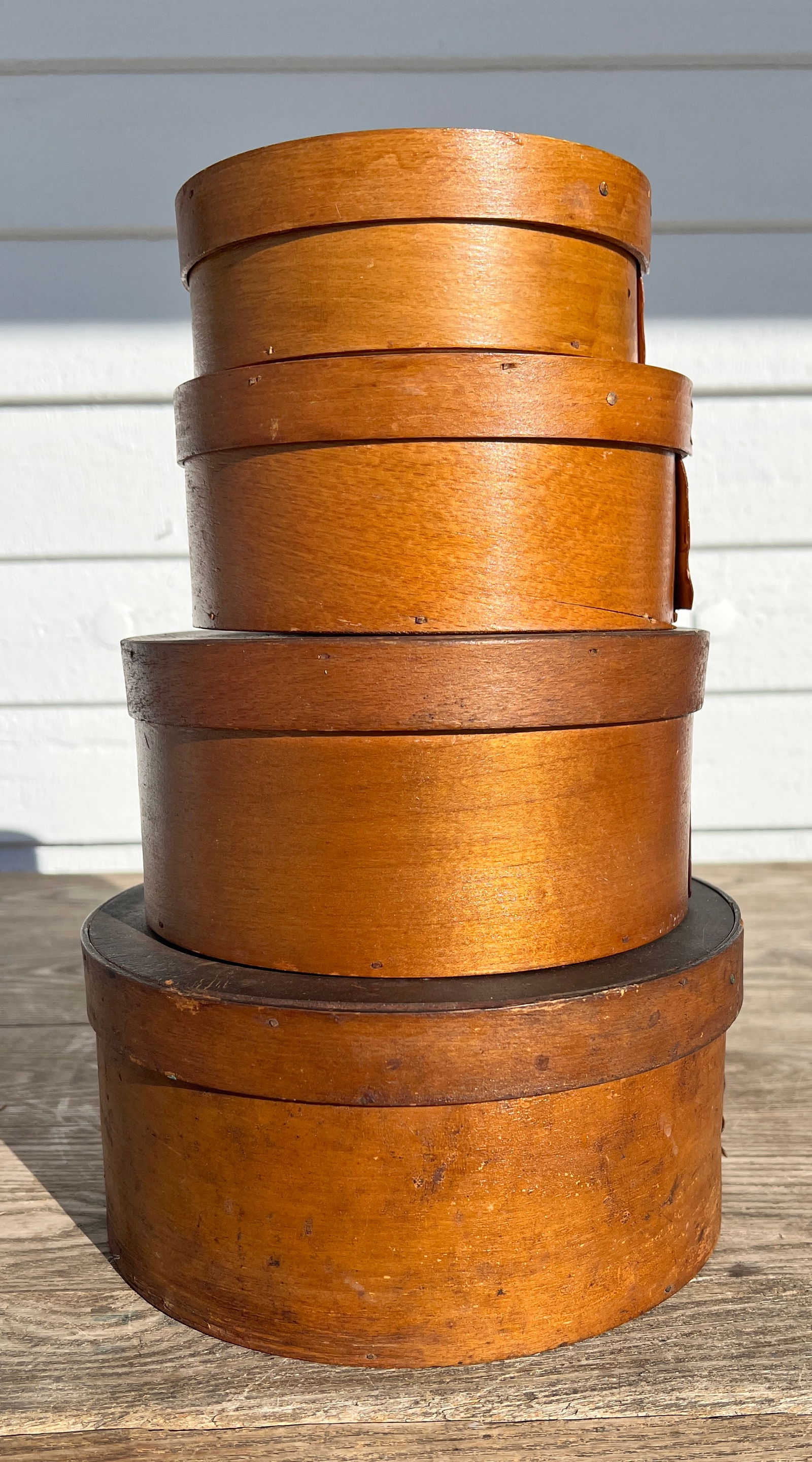 Set of 4 Graduated Natural Antique Pantry Boxes: Out of a local farmhouse. As shown nice shape w/ some small breaks and blemishes. They all fit into each other w/ as you can see the patina outline when they were stacked in a pantry over many years.