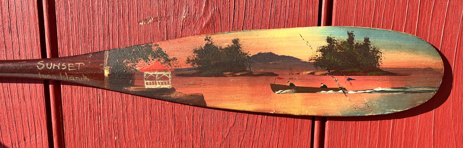Sunset 1,000 Islands Alpheus Keech Adirondack Folk Art Canoe Paddle: Circa 1910. Great colors and patina. 21 inches long. What's to Love - The Cris Craft style boat racing towards gazebo.