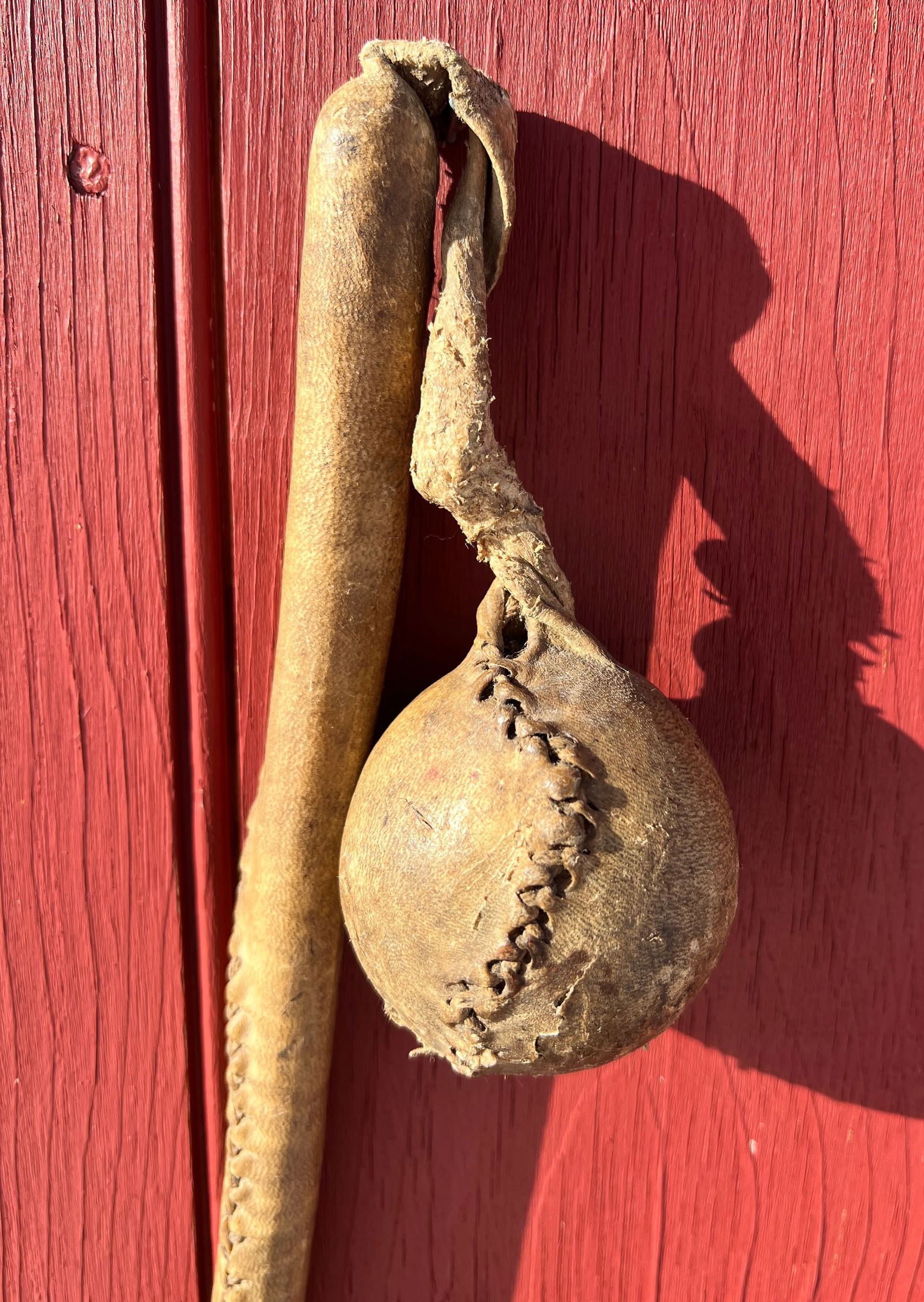 Plains American Native Indian War Club Weapon: Circa 1870's Slung Shot Club. Possibly Cree or Apache? What's to Love - Made with one piece of leather, the leather wrapped wood handle continues to wrap and hold a hard ball.