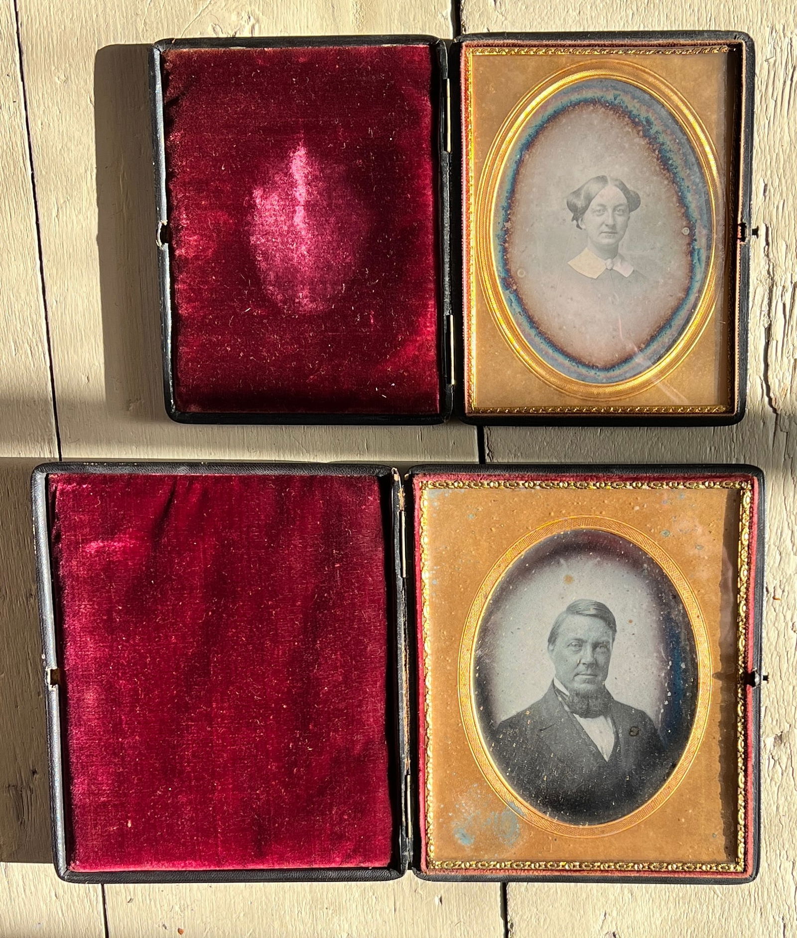 Pair of Early Daguerreotype Photographs 3/4 Plate & 1/2 Plate: The smaller is an odd 3/4 size I do believe. Early leather cases w/ push button. What's to Love - Pretty sure they were Husband and Wife.