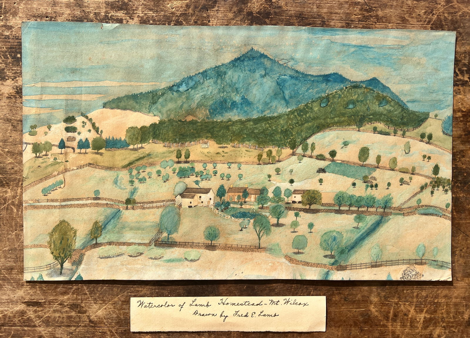 1880's Vermont Mt. Wilcox Folk Art Farmhouse Homestead Watercolor Painting: Charming painting of a farmstead and identified as Mt Wilcox (which is in Vermont) and painted by a family member from the Lamb Homestead. Folksy and well executed. Not framed. Approx 9 by 14 inches.