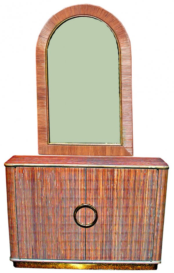 Karl Springer console and mirror in reeded bamboo.: Furniture: Karl Springer console and mirror in reeded bamboo. Wood frame construction. Completed in an alternating violet and light purple pickled finish with large symmetrical split brass pulls on th