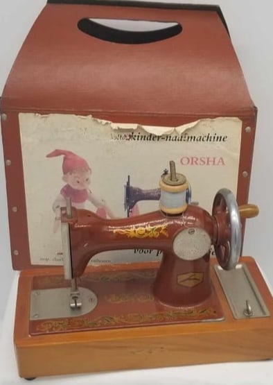 Germany Toy Sewing Machine: a Very nice little sewing machine, seems to function ok, very decorative, with original box and directions, about 6 1/2 inches tall