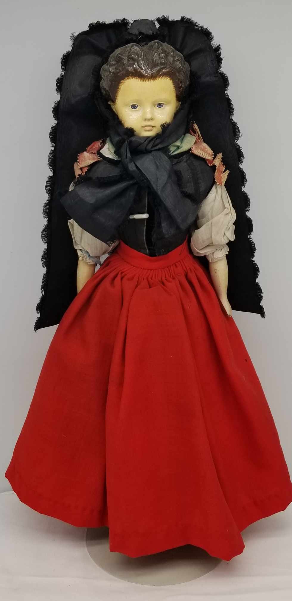 Muller & Strassburger Doll ~ Paper Mache 1870s: papier-mâché shoulderhead, wooden lower arms and legs, cloth body, painted and elaborately carved brown hair, Painted features and boots. Originally Dressed in south German traditional costume, Prob