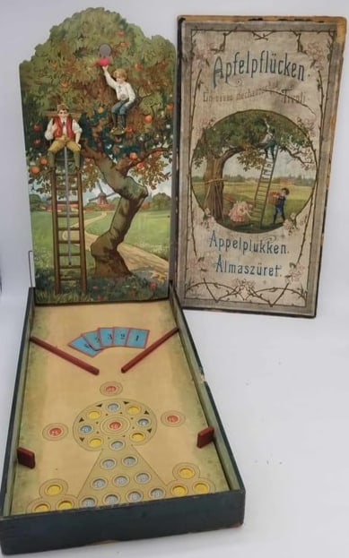 Apple Pickers Marble Game ~ Tivoli: a beautifully lithographed game, large and Impressive, works well, when the boy at the top gets a marble in his basket, he tips it to his friend and he climbs down the tree then dumps it, late 19th or