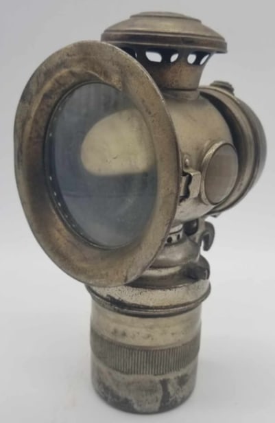 Early Carbide Motorcycle / Bike Light: a rare old carbide lamp, these were used on Bicycles and motorcycles, appears to be complete with burner. about 8 inches tall