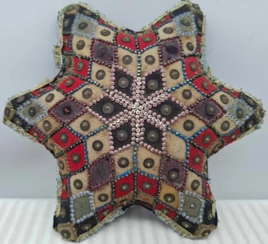 Sailor's love token pincushion ~ circa 1800: sailor's love token pincushion, Pin work, pieced together, early 19th century, in the form of a star decorated with beadwork and tassels