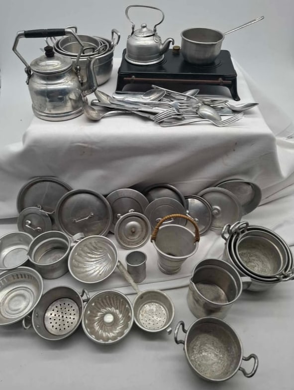 German Toy stove with 50 pieces of Cookware: very cute toy stove, it has an alcohol burner, includes about 40 pieces of cookware, stove is about 4 x 7 inches