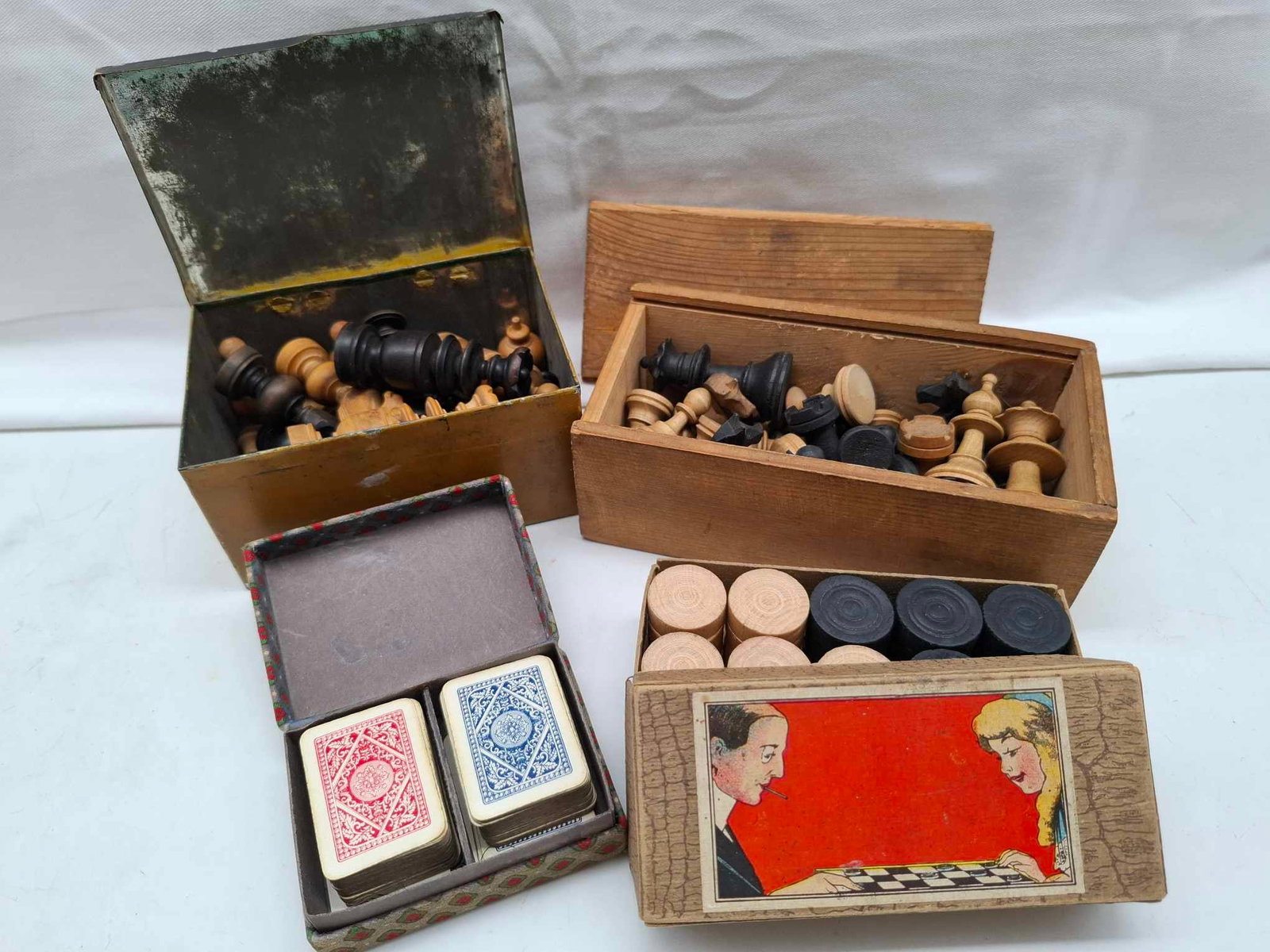 Chess Pieces ~ Miniature Cards ~ Drafts ~ Tole Box: an assortment of chess pieces, one in a Tole Box that is very nice, miniature cards in original box, and a box of checkers,