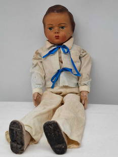Old Wood & Paper Mache Doll: a neat old doll, he has a paper mâché head, a wooden body, hands and feet are made of some hard substance, I'm not sure what, he dates to the middle of the 1900s, he is about 20 inches tall