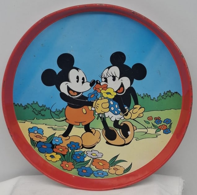 Vintage Mickey & Minnie Mouse Tin Tray – Virojanglor, Paris France: Delightful vintage round tin tray produced in Paris, France by Virojanglor, featuring the timeless duo Mickey and Minnie Mouse. The design showcases the beloved characters in bright, cheerful colors t