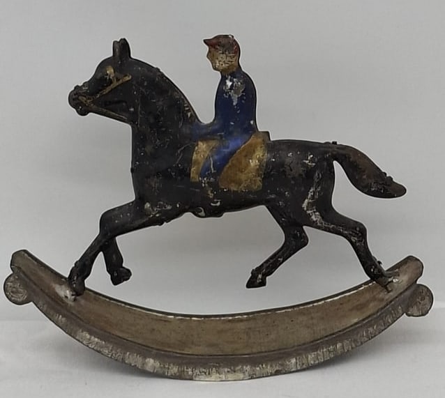 Antique Soldered Tin Toy Rocking Horse with Rider, Circa 1870 – Original Paint, 5 Inches: A charming and scarce 19th-century toy, this soldered tin rocking horse with rider dates to circa 1870. Finely detailed for its small scale, the figure captures the enduring appeal of early European t