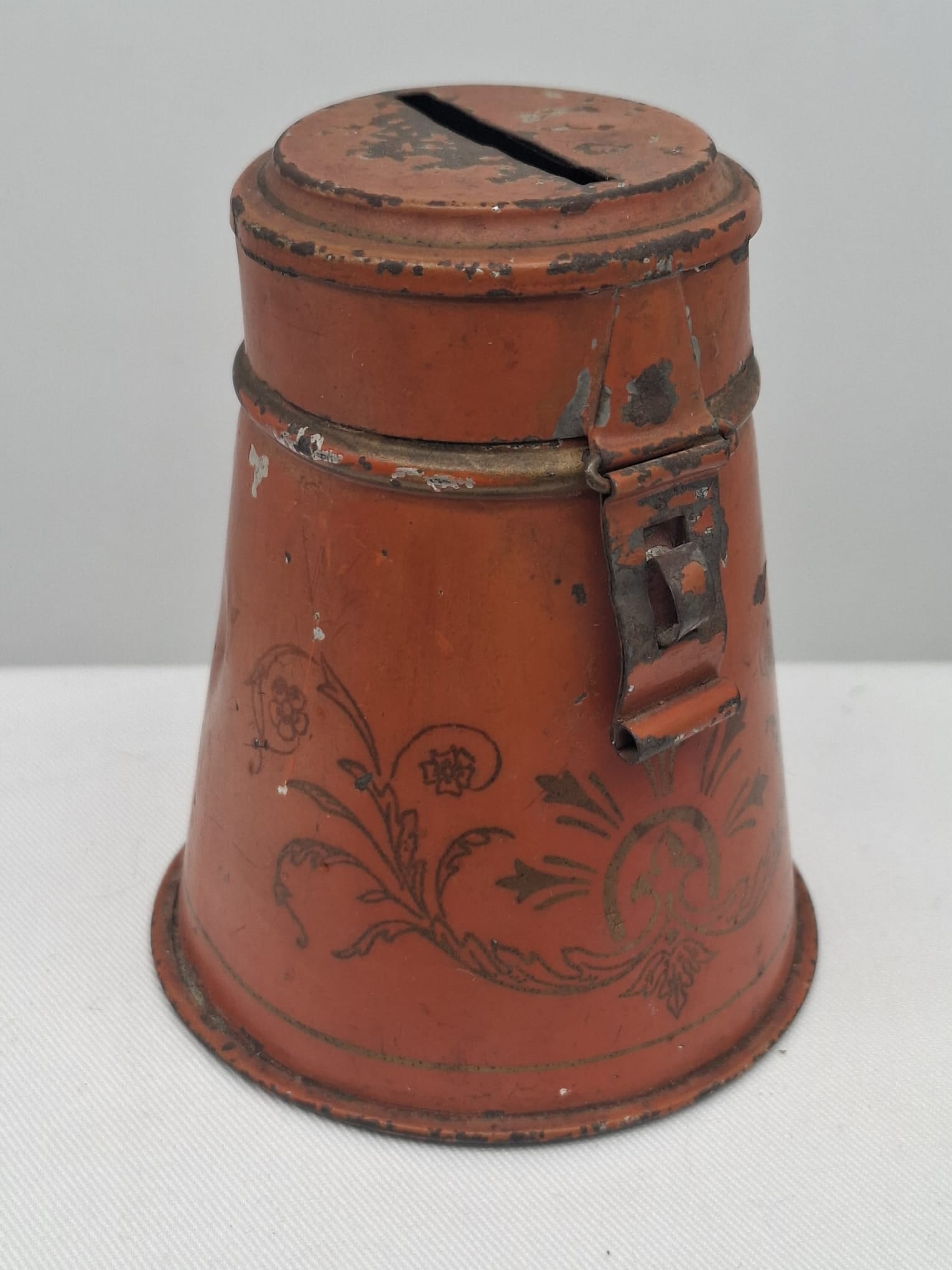 19th Century Toleware Penny Bank with Original Paint & Stenciling: A charming 19th-century toleware penny bank retaining its original painted surface and decorative stenciling. This attractive example displays the rich character and folk-art appeal that make early to
