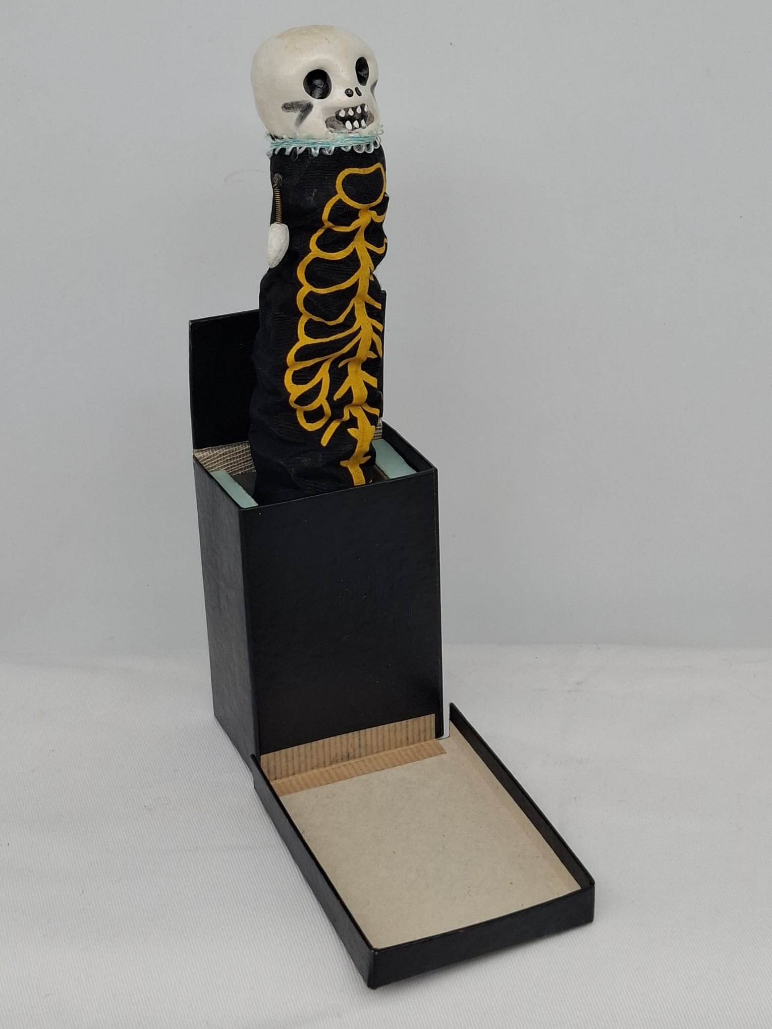 Rare Pre-WWII Halloween Jack-in-the-Box with Skeleton Figure: Exceptionally unusual and evocative antique Halloween jack-in-the-box dating to the pre–World War II era. Constructed of cardboard with a paper mâché and cloth skeleton figure, this delightful hol