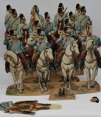 Rare 19th Century French Chromolithographed Expandable Paper Toy Soldiers by E. & Cie: A rare and fascinating group of 19th century French chromolithographed paper toy soldiers produced by E. & Cie, beautifully printed in vivid period color and designed as expandable or articulated pape