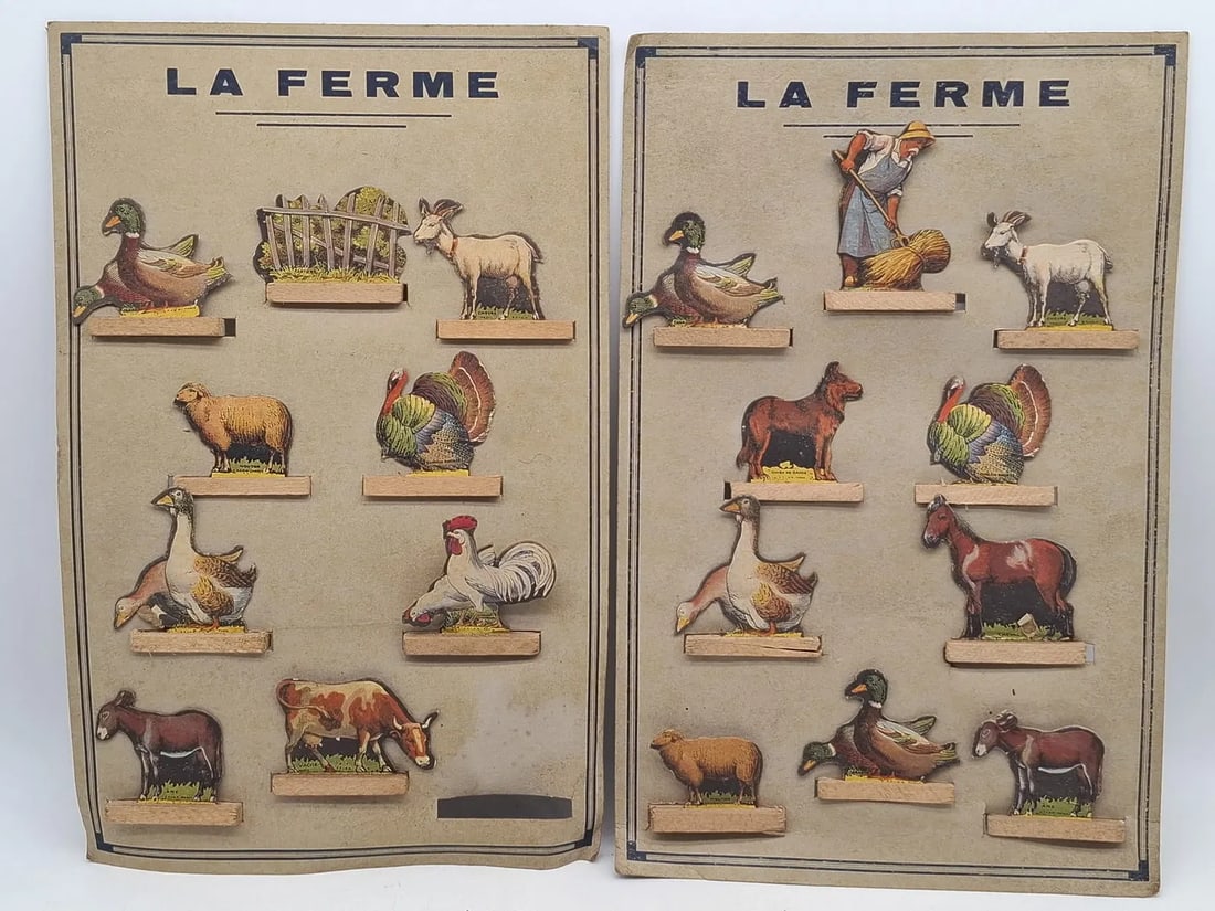 French Farmyard Die-Cut Cardboard Toy Set on Original Card, Interwar Period: Charming French farmyard toy set featuring die-cut cardboard figures mounted on wooden bases and presented on the original printed display card. Produced in Paris during the interwar period, likely