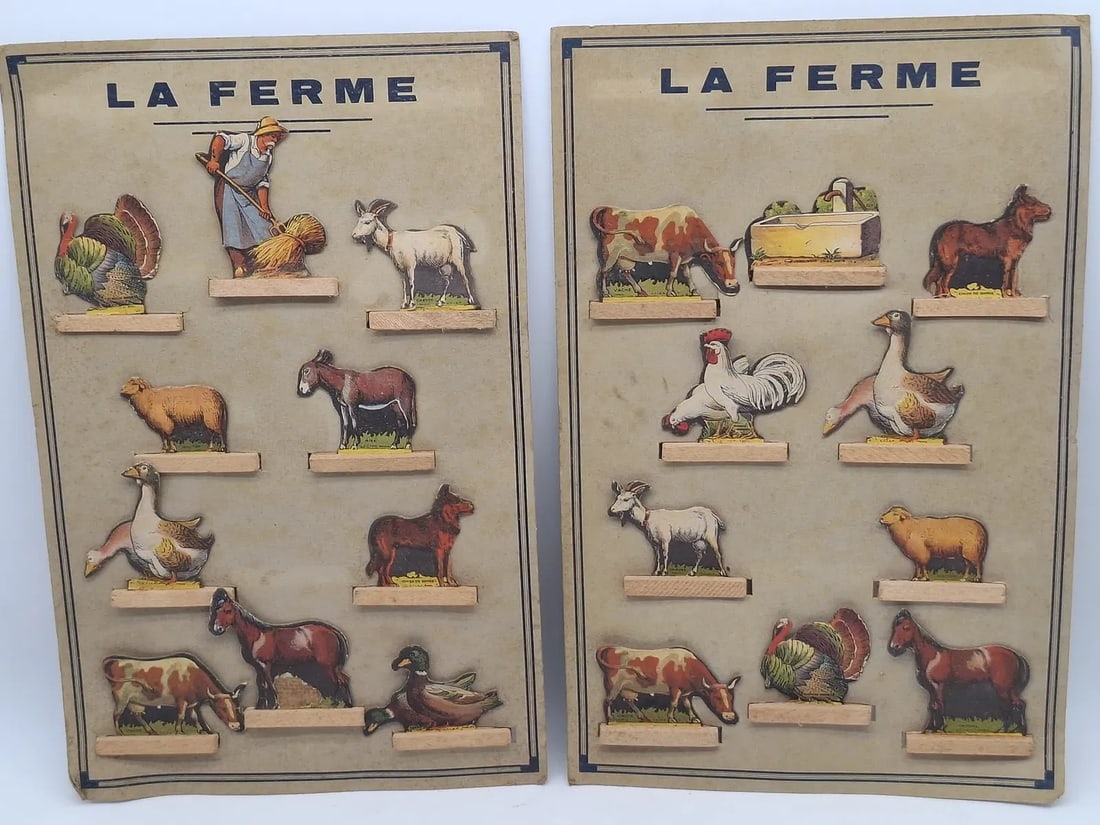 French Farmyard Die-Cut Cardboard Toy Set on Original Card, Interwar Period: Charming French farmyard toy set featuring die-cut cardboard figures mounted on wooden bases and presented on the original printed display card. Produced in Paris during the interwar period, likely