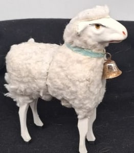 Sheep Candy Container with Wooden Legs, Papier-Mâché: A wonderfully unusual sheep-form candy container, in papier-mâché with carved wooden legs and designed to separate at the middle to hold sweets or small treats inside. Measuring approximately 16 cm 