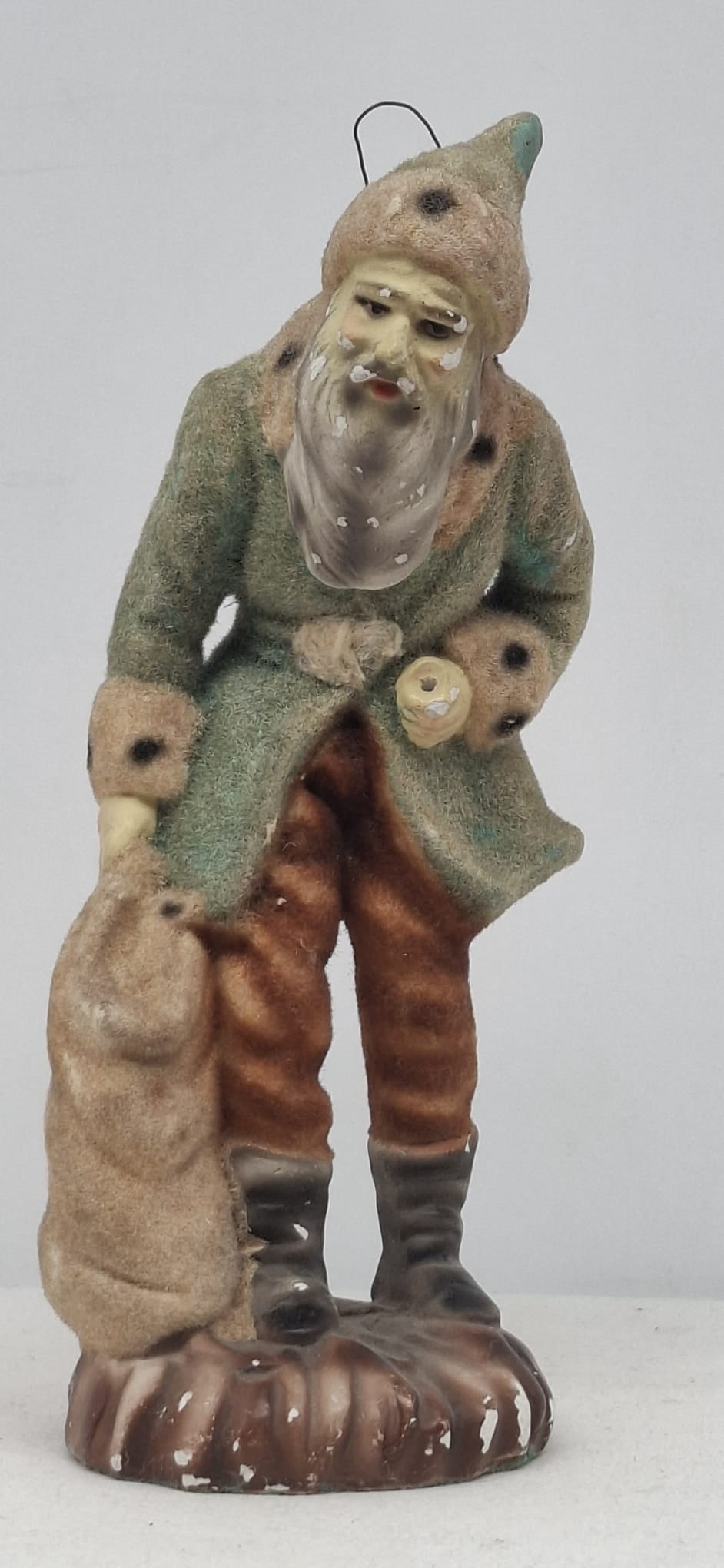 Charming Antique German Santa Claus Figure with Green Coat & Flocked Finish: A wonderfully charming antique vintage Santa Claus figure, likely German in origin, beautifully molded and painted with an appealing flocked finish. Standing approximately 18 cm tall (7.1 inches), thi