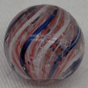 Handmade German Glass Marble, Early 20th Century: A fine handmade German glass marble dating to the early 1900s. This attractive example measures approximately 1.75 cm (0.69 inches) in diameter and displays the craftsmanship that made German marbles 