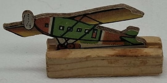 Embossed Cardboard plane on Wood Base - Germany: this is a very nice little embossed figure, made in Germany before World War 2, he is about 2 3/4 inches tall, these were given away by retail stores in Germany for Christmas and Easter.