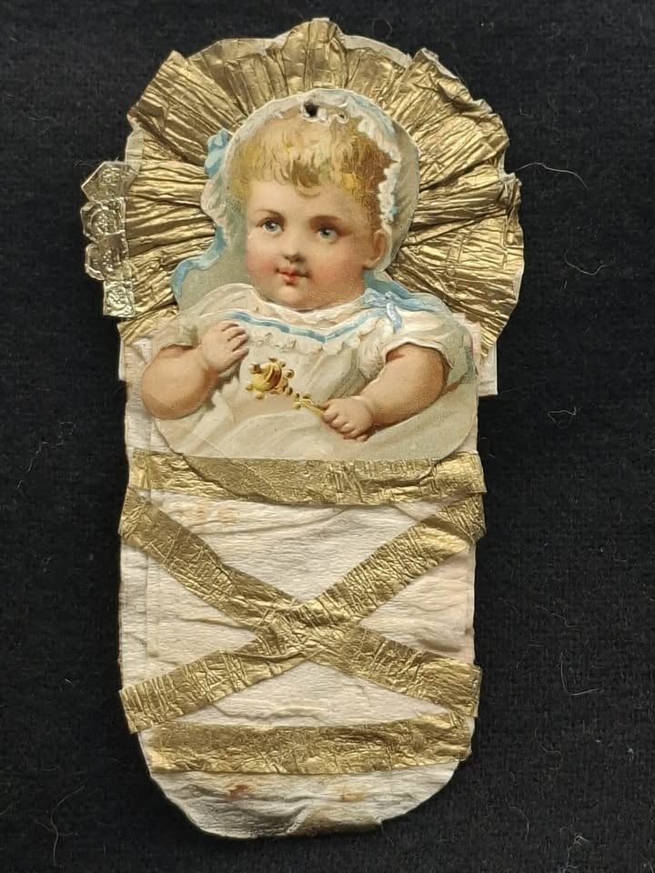 Crepe Paper Baby Ornament: A very nice old Crepe Paper Baby with a scrap face, about 5 inches tall