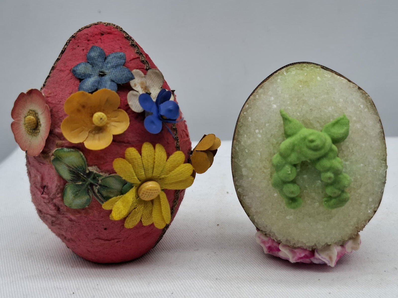Easter Egg Candy Container and Peep Show: Two nice old eggs, one made of sugar with a scene inside and the other made of cotton with flowers, about 3 inches tall