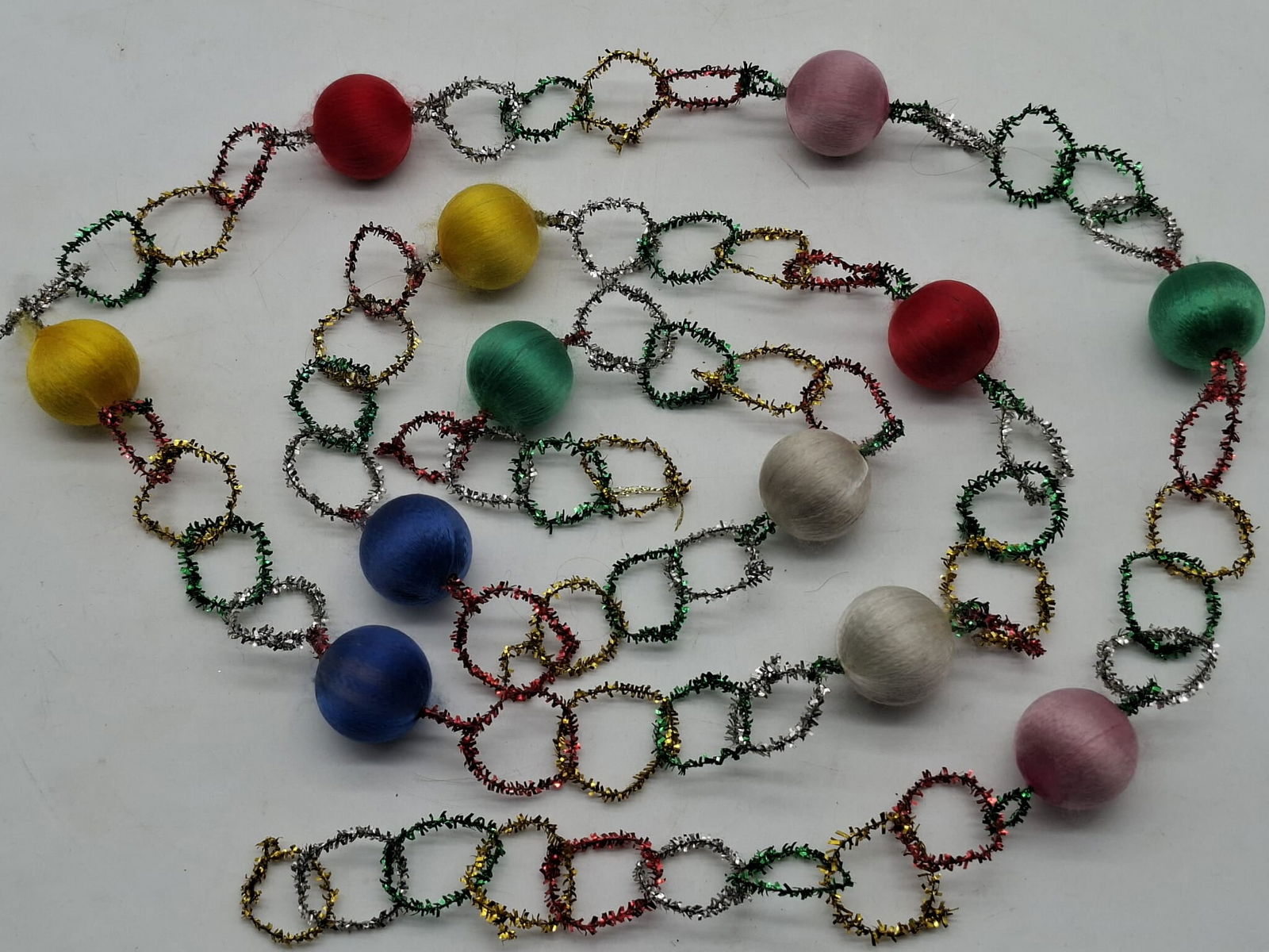 Unusual Christmas Garland: here is about 6 feet of unusual old Christmas tree garland, satin ball