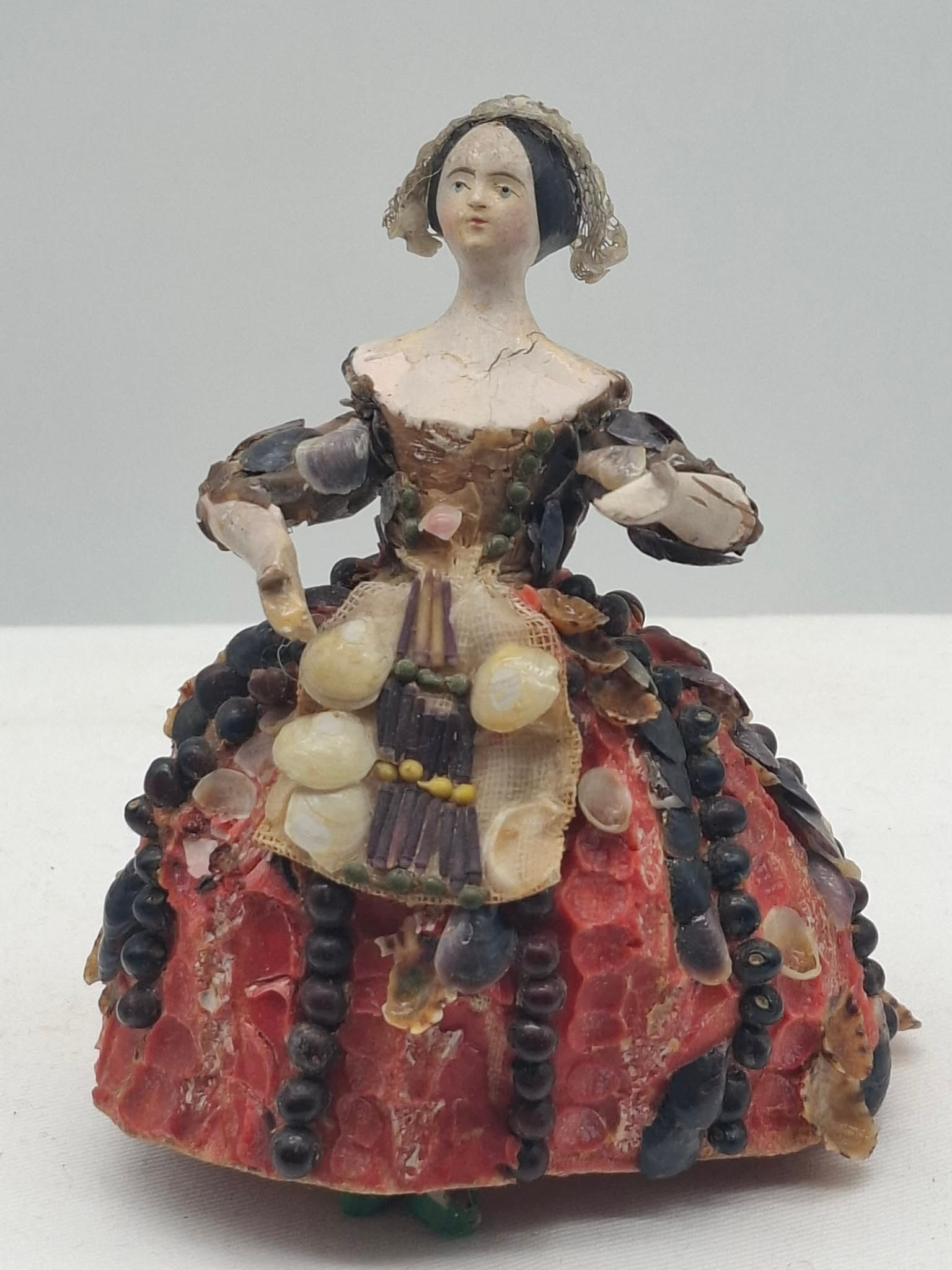 Antique Wooden Doll circa 1840: this is a great little wood doll; she is wearing her original clothes. So Fragile it is amazing that she has survived, there were probably more shells on her dress originally, she is a little over 4 i