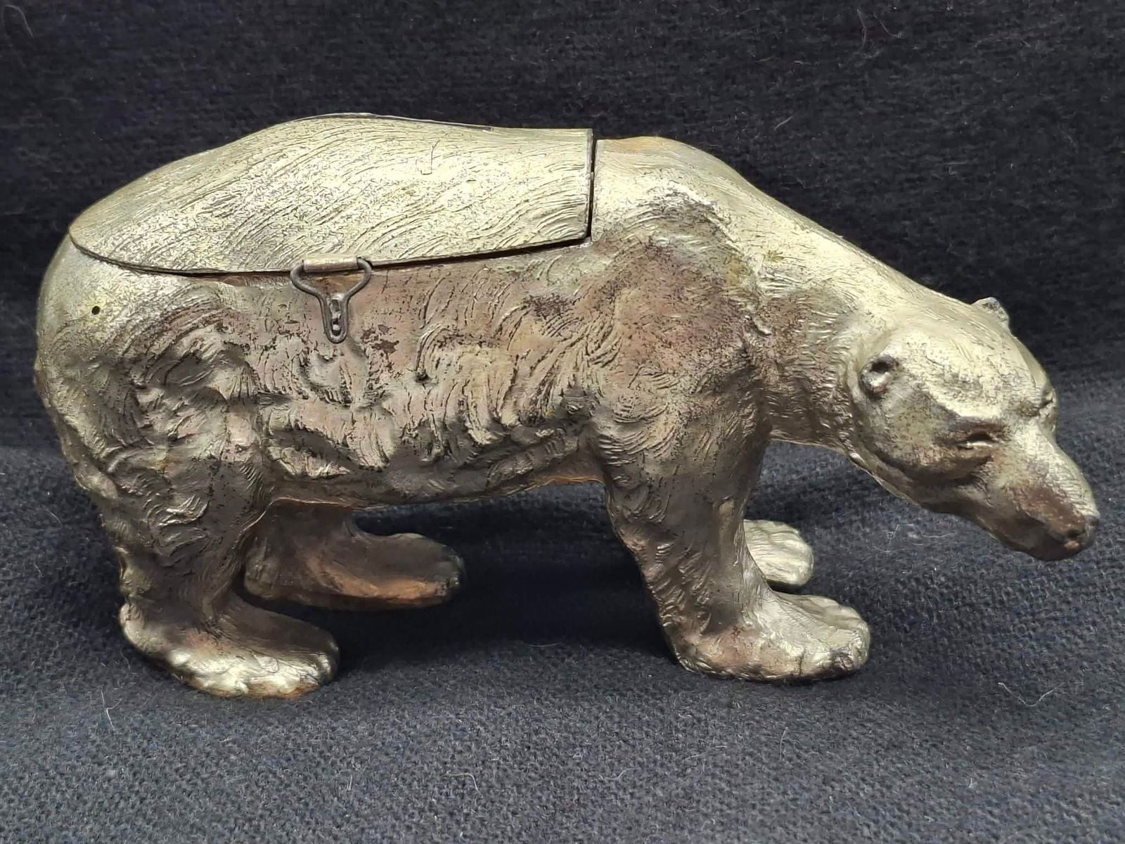 Polar Bear Bank: this is a great old cast metal bank in the form of a Polar Bear, about 8 inches long, crack at the top of one leg,