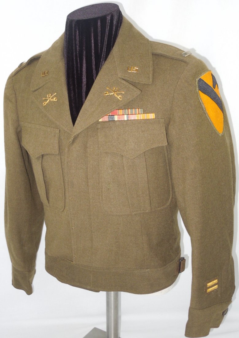 Named WWII 12th Cavalry Regiment Officer's Ike Jacket: WWII 1st Lieutenant's uniform named to J. Donovan on a small pinned on tag. Period WWII 12th Cavalry collar brass, pin on ribbons, pin back rank, overseas bars, etc.