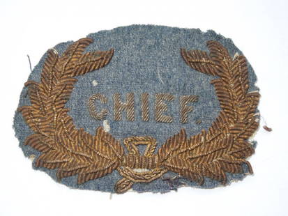 1800s US Military or Police Chief Bullion Hat Badge: Unknown type Chief badge in bullon with a wreath, on a gray/blue type wool background.